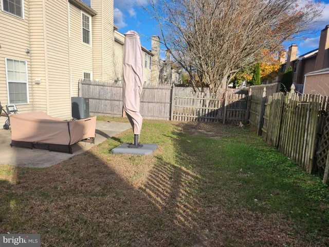 a view of a backyard with a tree