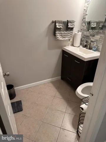 a kitchen with granite countertop stainless steel appliances a sink and cabinets