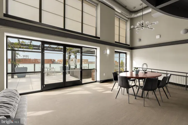 a view of a dining room with furniture and a window