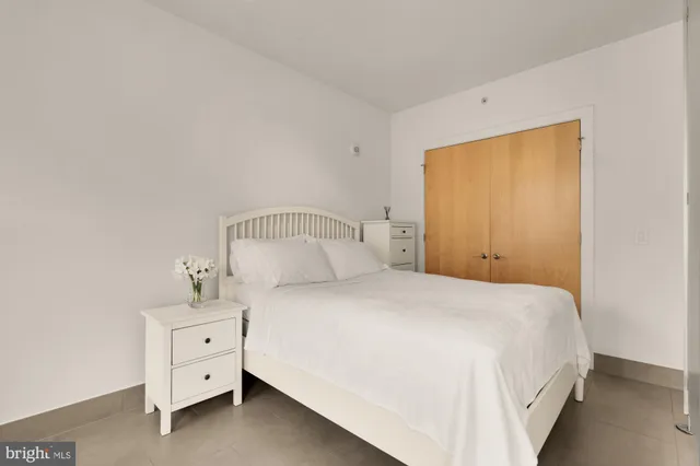 a bedroom with a bed and dresser