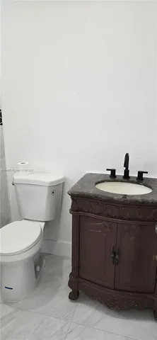 a bathroom with a toilet and a sink