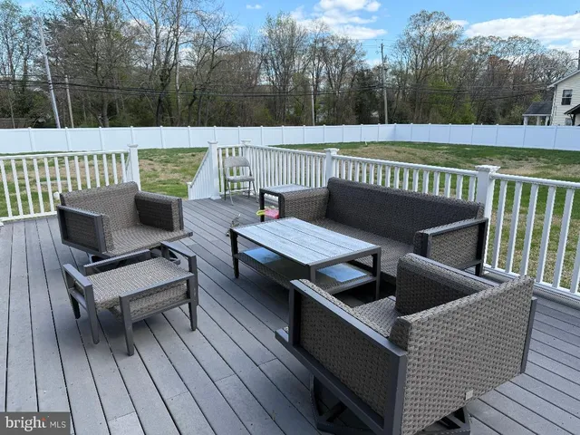 a view of sitting area with furniture in wooden deck