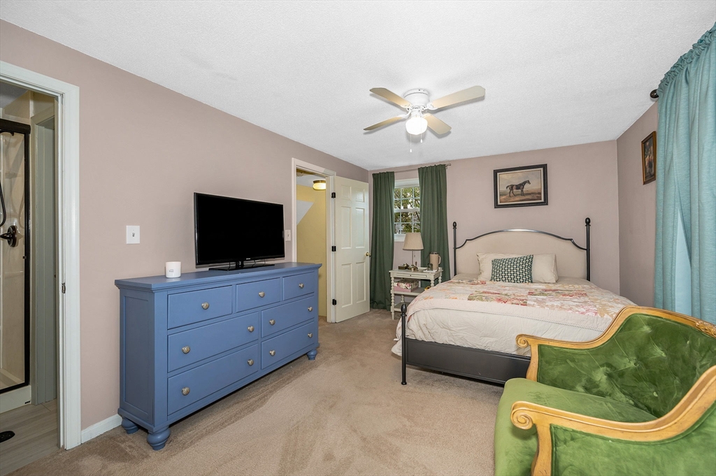 43 Constitution Way, Unit 43 Methuen, MA 01844 - Photo 16 of 25 a bedroom with a bed and a flat screen tv