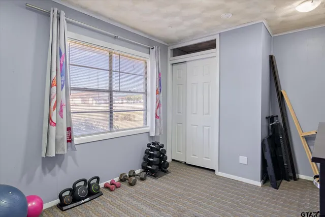 a room with a window and wooden floor