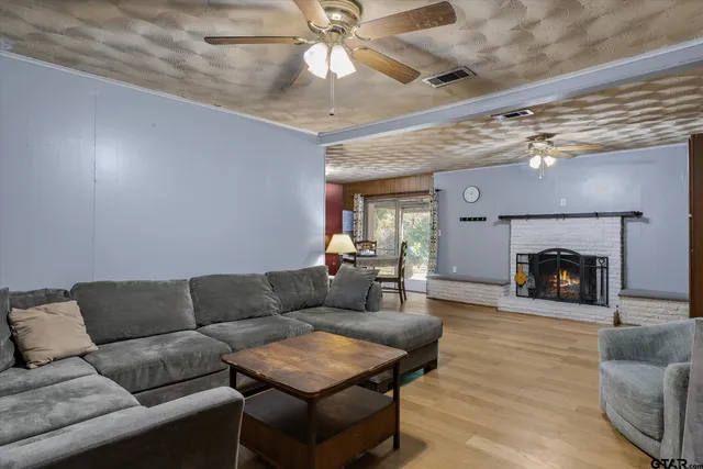 a living room with furniture and a fireplace
