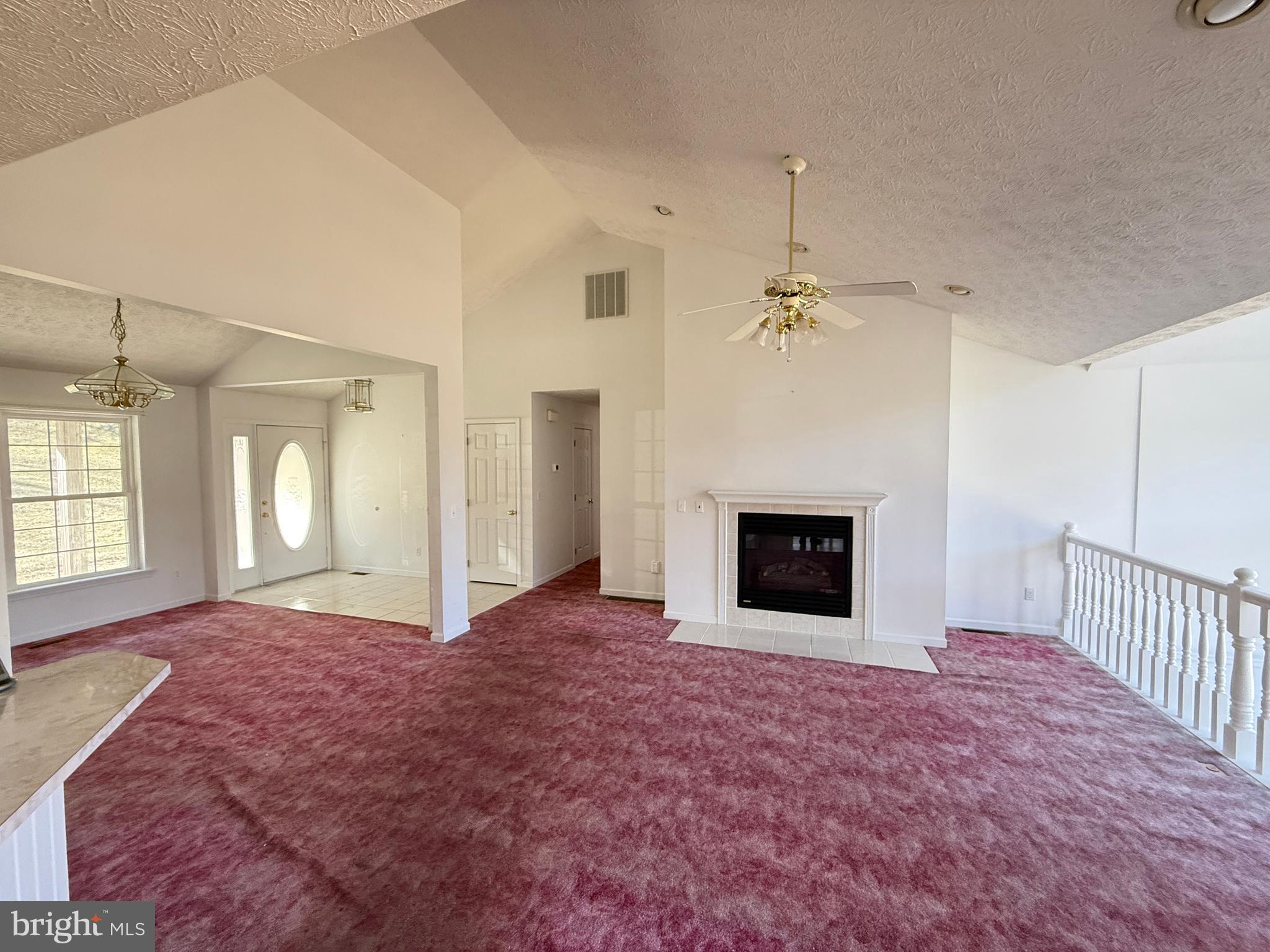 19322 Old Dans Rock Road Southwest Frostburg, MD 21532 - Photo 24 of 67 an empty room with windows and fireplace