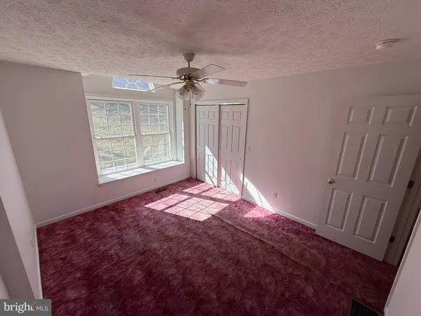 a view of staircase with railing and a floor to ceiling window