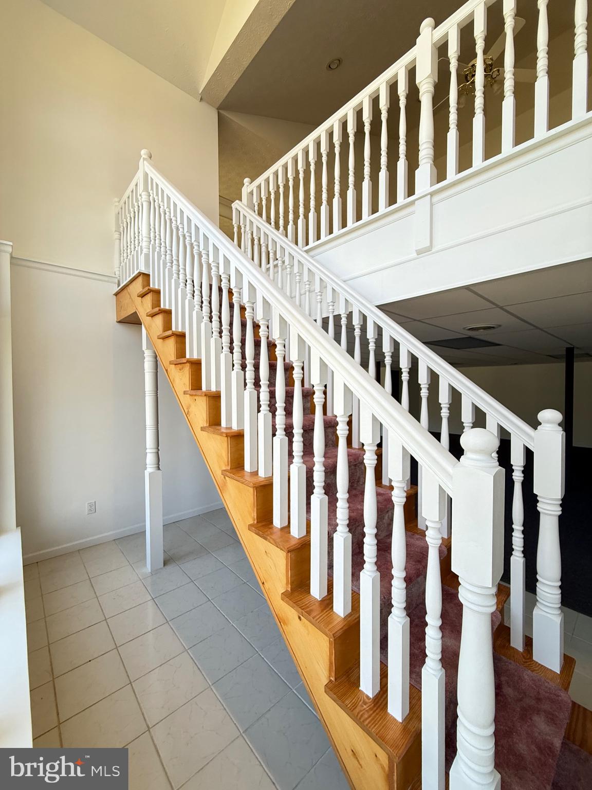 19322 Old Dans Rock Road Southwest Frostburg, MD 21532 - Photo 46 of 67 a view of staircase with railing and a floor to ceiling window