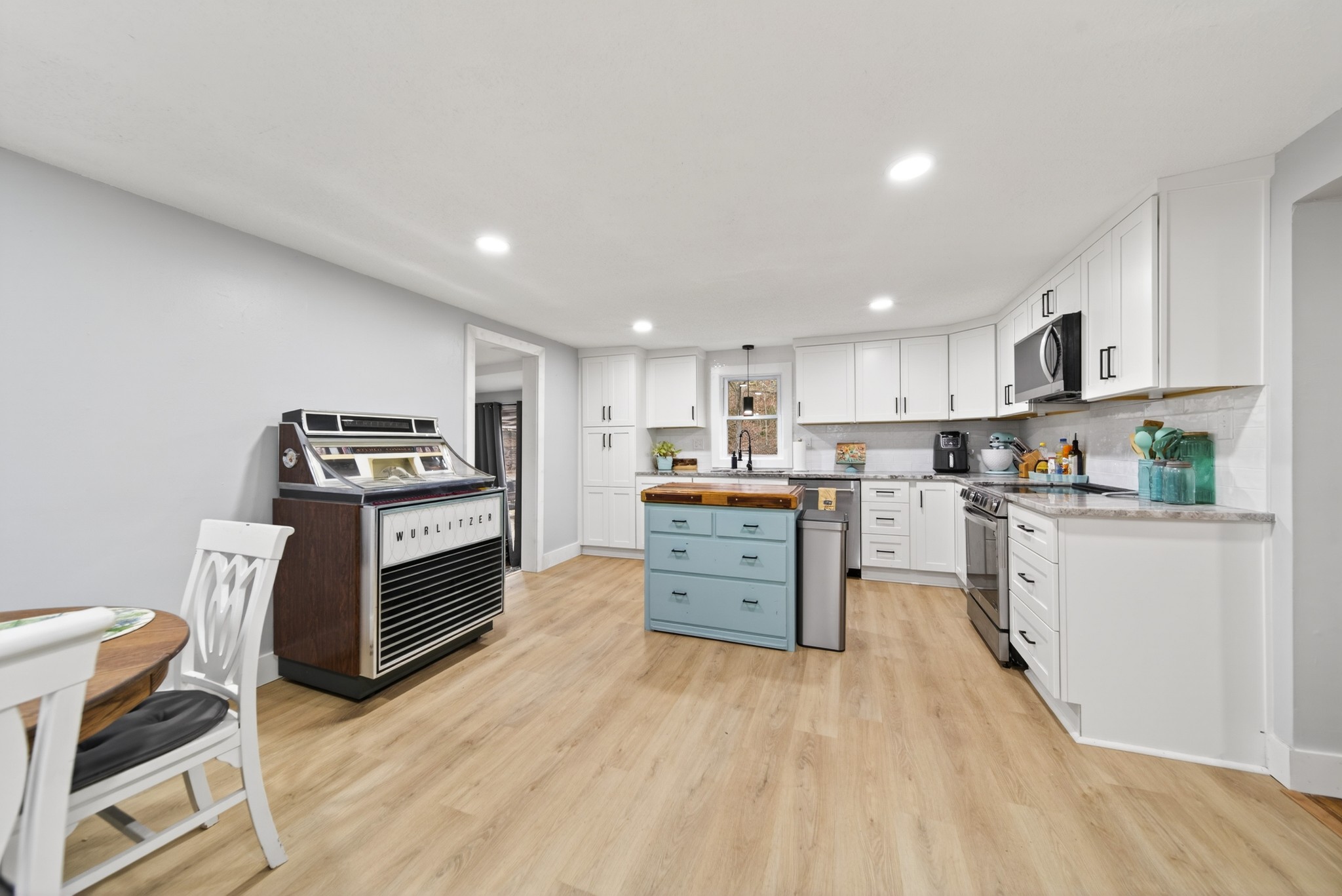 3332 Abednego Road Greenbrier, TN 37073 - Photo 46 of 86 a kitchen with granite countertop a stove top oven and cabinets