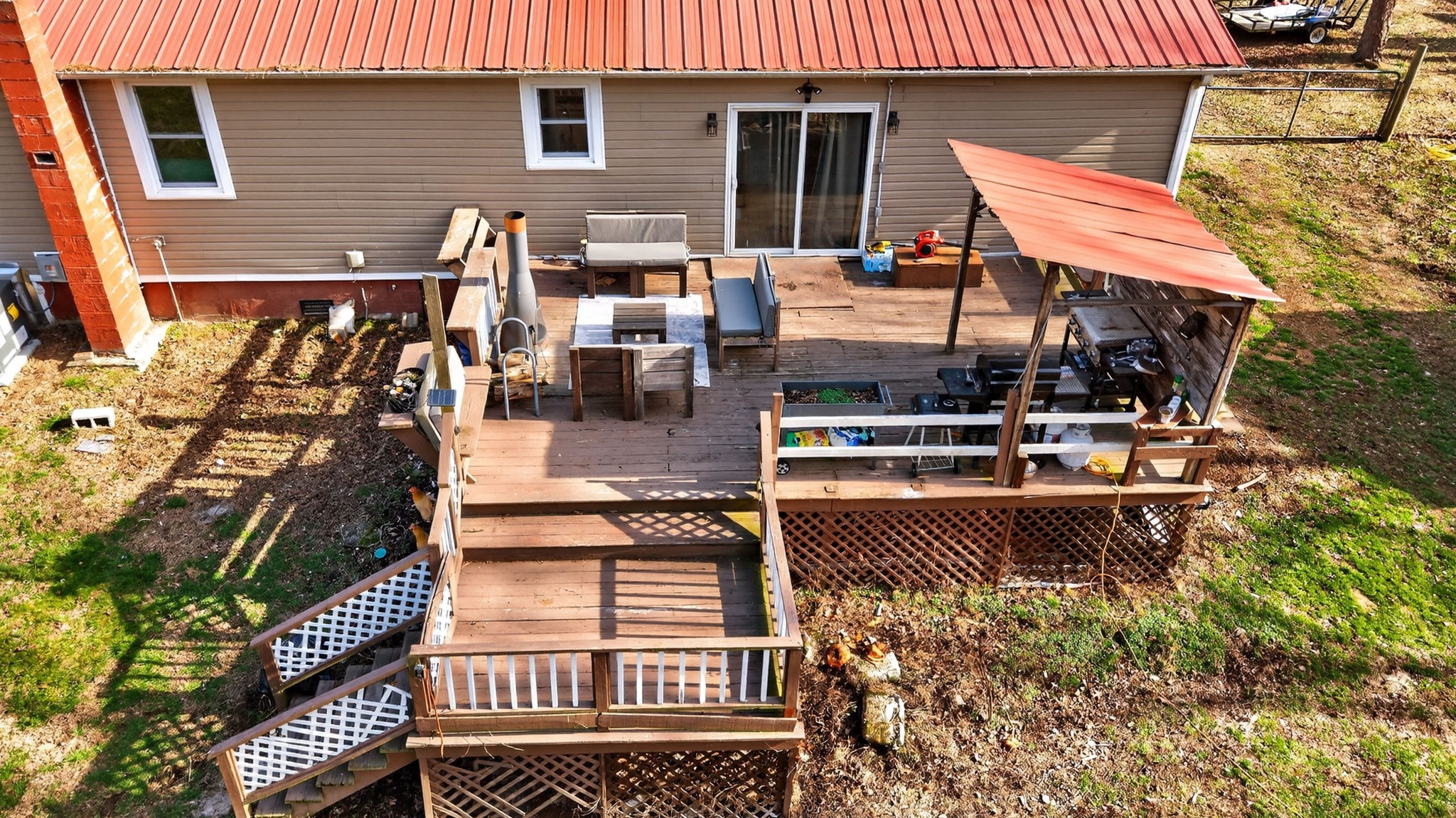 3332 Abednego Road Greenbrier, TN 37073 - Photo 80 of 86 a view of a patio with table and chairs with wooden floor and fence