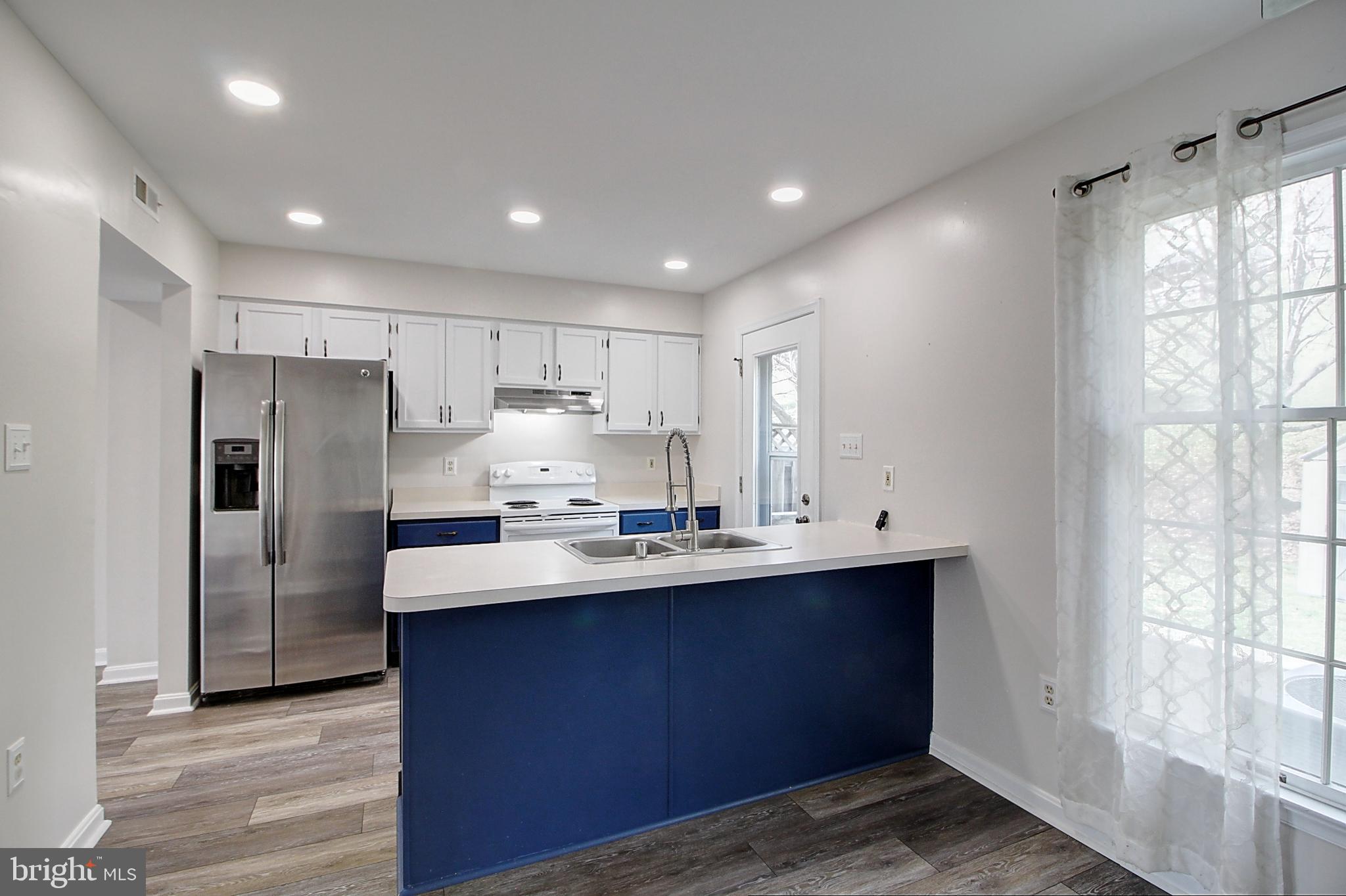 2415 Prentice Court Frederick, MD 21702 - Photo 4 of 20 a kitchen with refrigerator and window