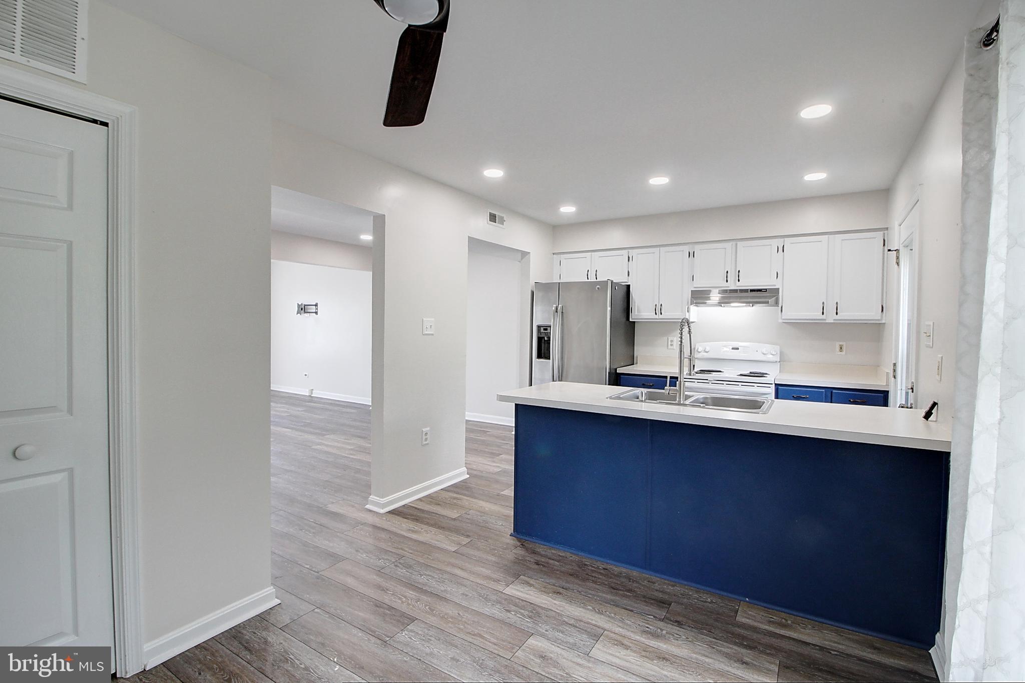 2415 Prentice Court Frederick, MD 21702 - Photo 5 of 20 a kitchen with stainless steel appliances granite countertop a sink stove and refrigerator