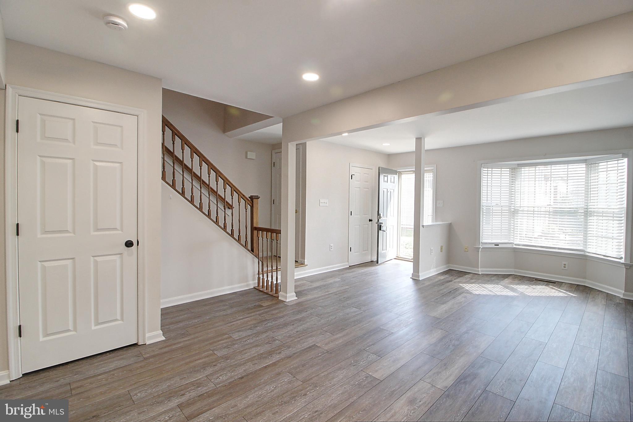 2415 Prentice Court Frederick, MD 21702 - Photo 7 of 20 a view of empty room with wooden floor and fan
