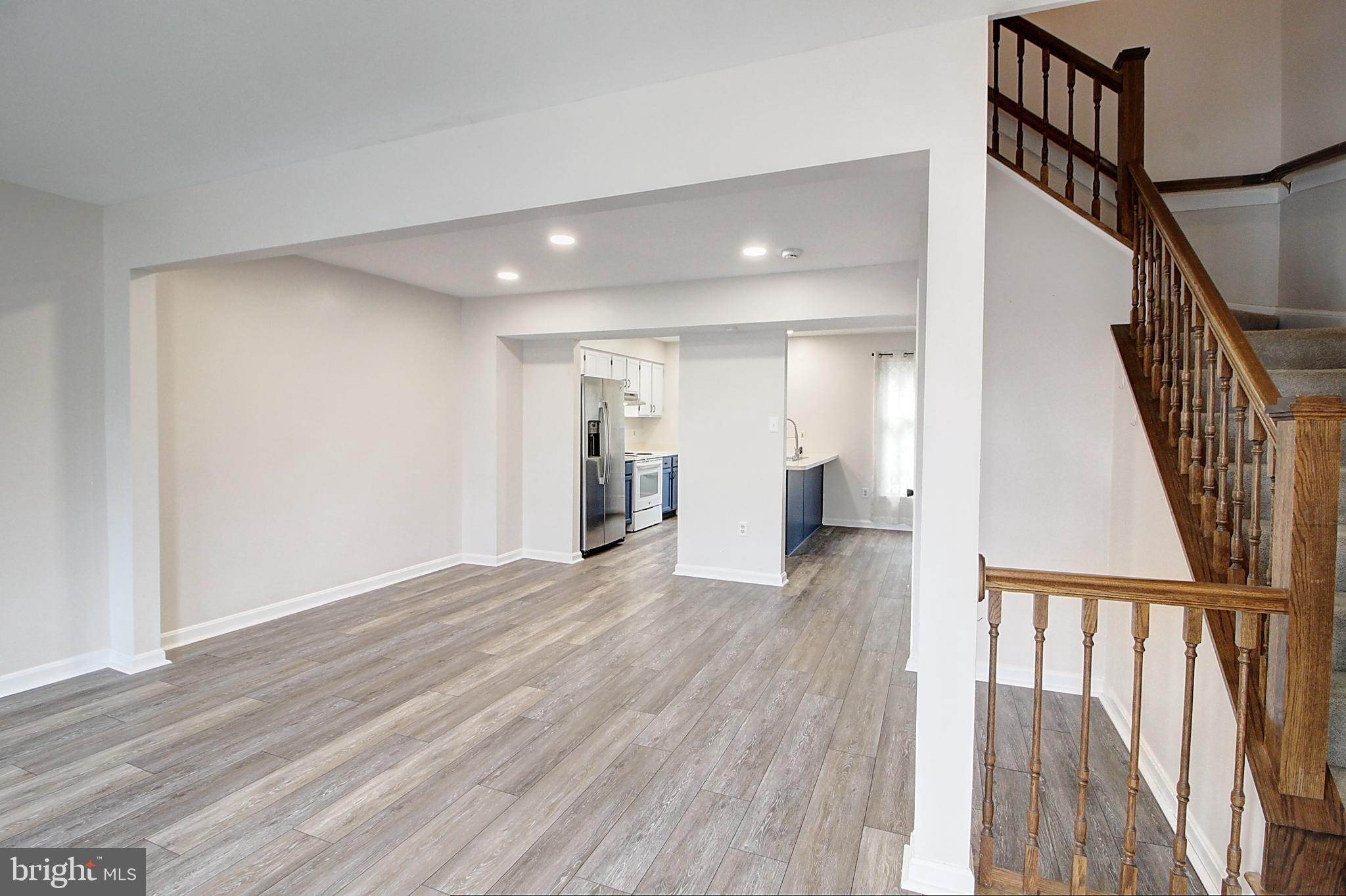 2415 Prentice Court Frederick, MD 21702 - Photo 10 of 20 a view of entryway with wooden floor and stairs