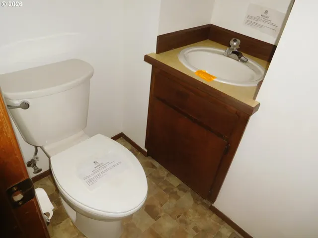 a bathroom with a toilet and a sink
