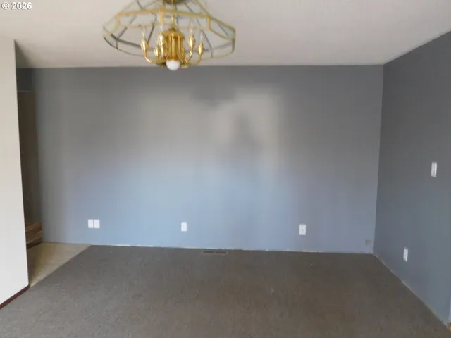 a view of room that has a lot of white wall