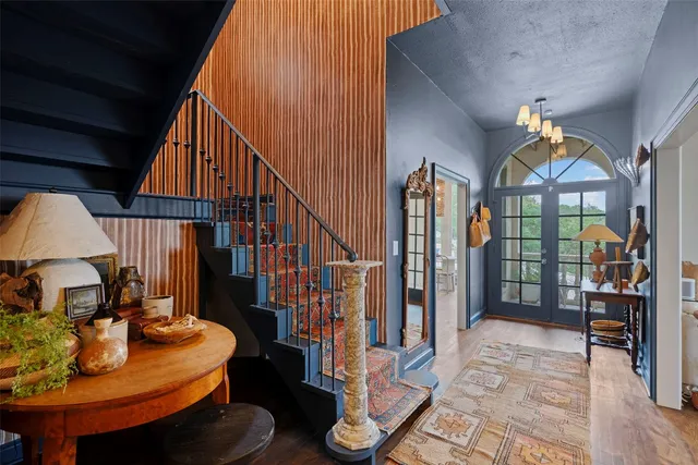 a view of a livingroom with furniture and staircase