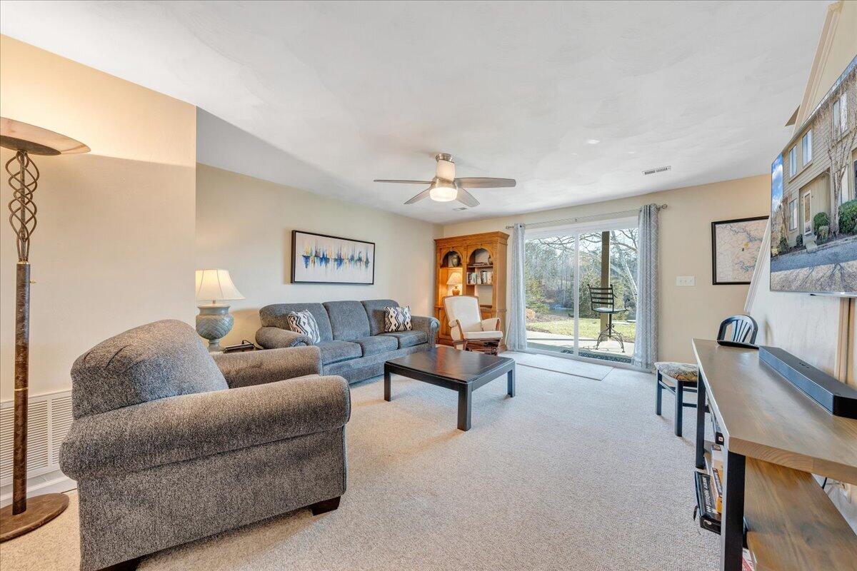 506 Harbor Ridge Drive Goodview, VA 24095 - Photo 28 of 39 a living room with furniture and a large window