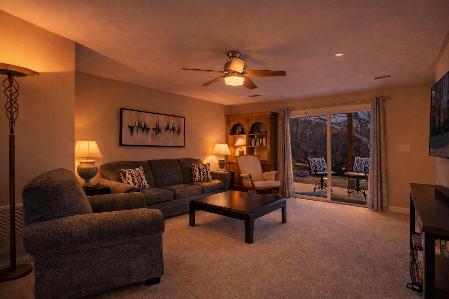 506 Harbor Ridge Drive Goodview, VA 24095 - Photo 29 of 39 a living room with furniture and a chandelier