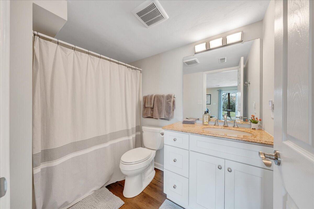 506 Harbor Ridge Drive Goodview, VA 24095 - Photo 30 of 39 a bathroom with a sink a toilet and shower