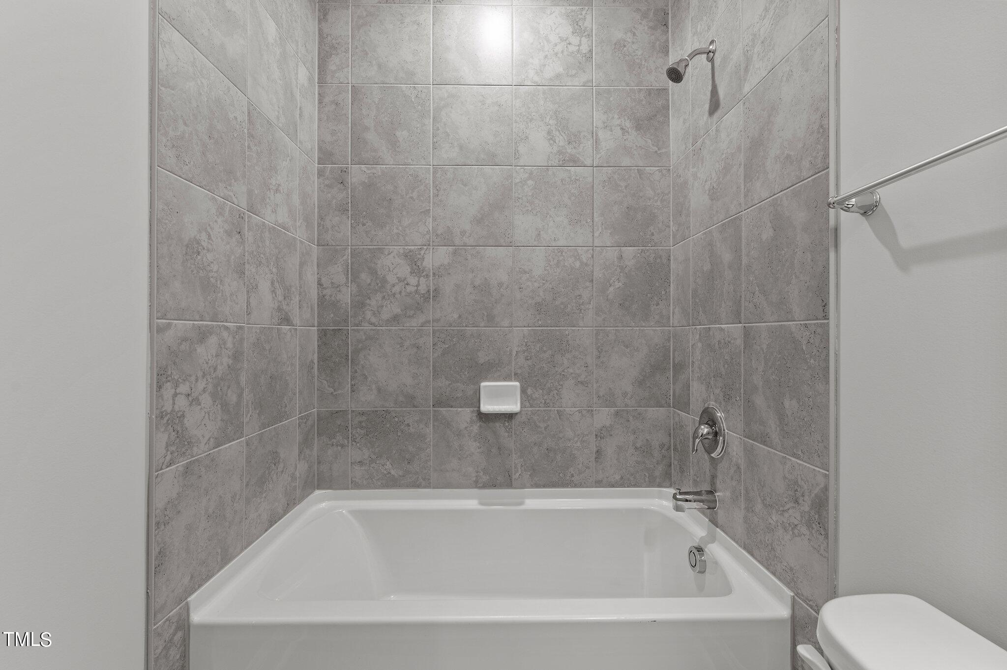 579 Forestville Road Wake Forest, NC 27587 - Photo 17 of 34 a close view of a bathtub in bathroom