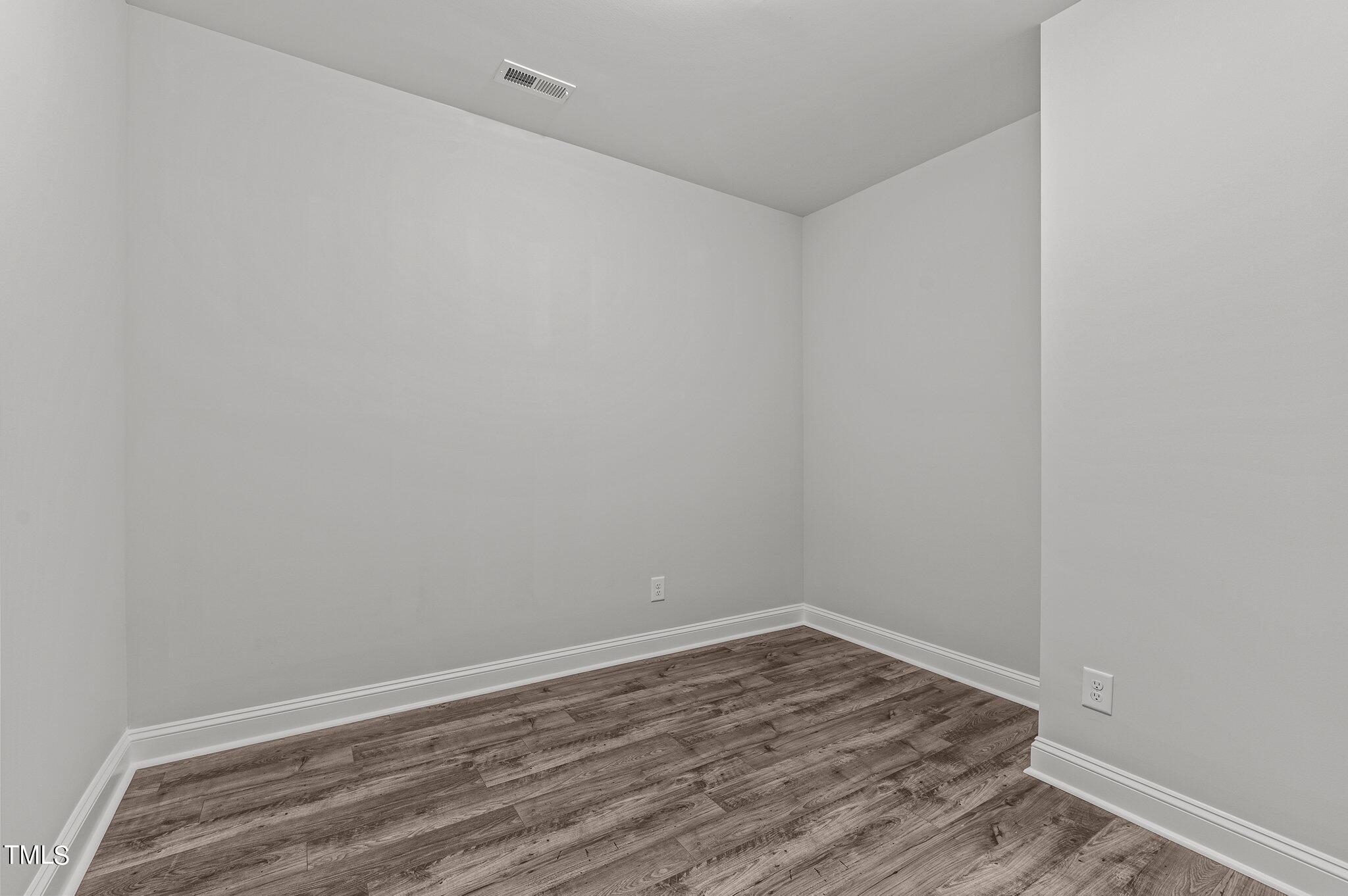 579 Forestville Road Wake Forest, NC 27587 - Photo 19 of 34 a view of a room with wooden floor