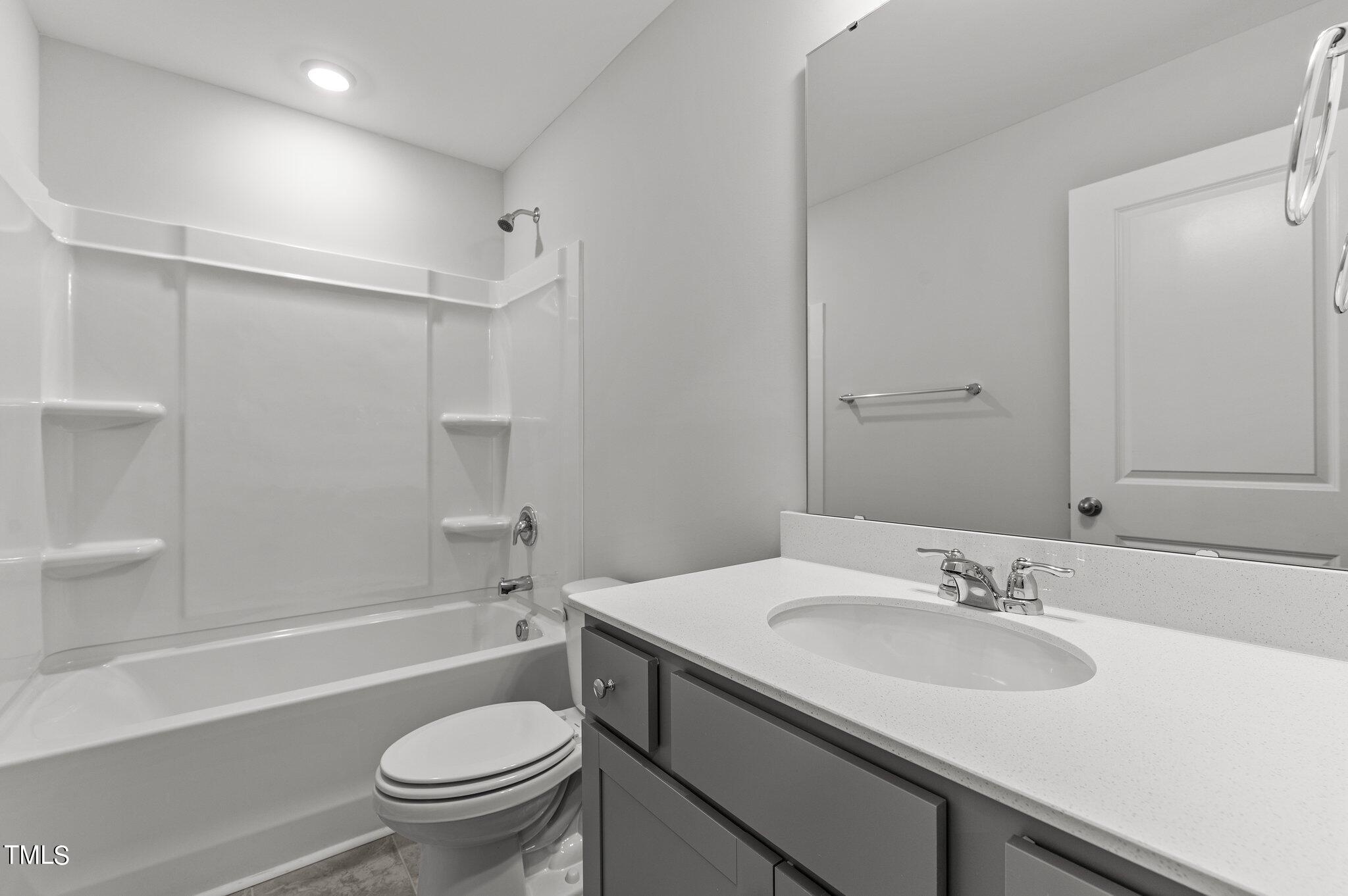 579 Forestville Road Wake Forest, NC 27587 - Photo 24 of 34 a bathroom with a sink toilet vanity granite tub and shower