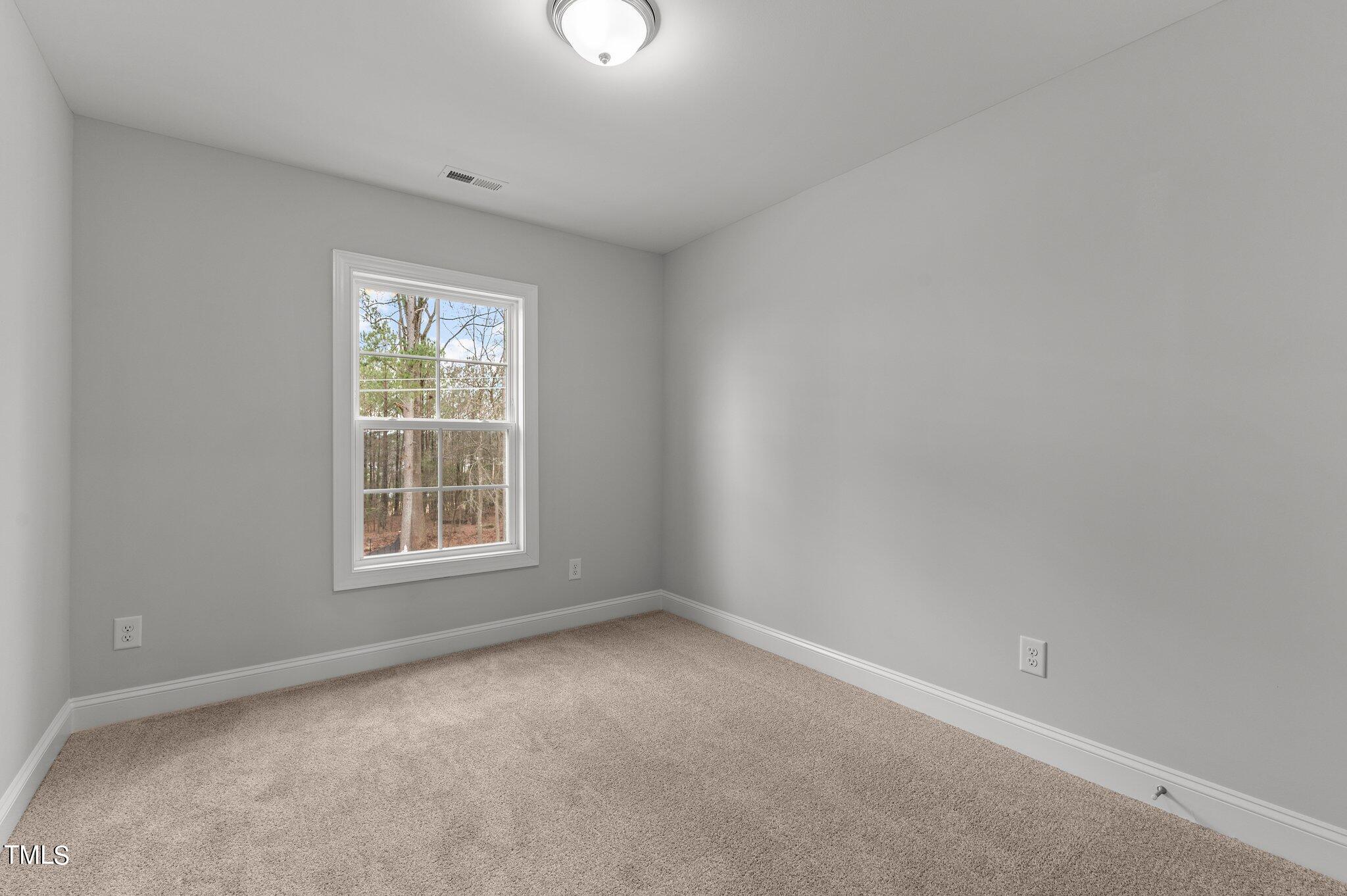 579 Forestville Road Wake Forest, NC 27587 - Photo 26 of 34 an empty room with a window
