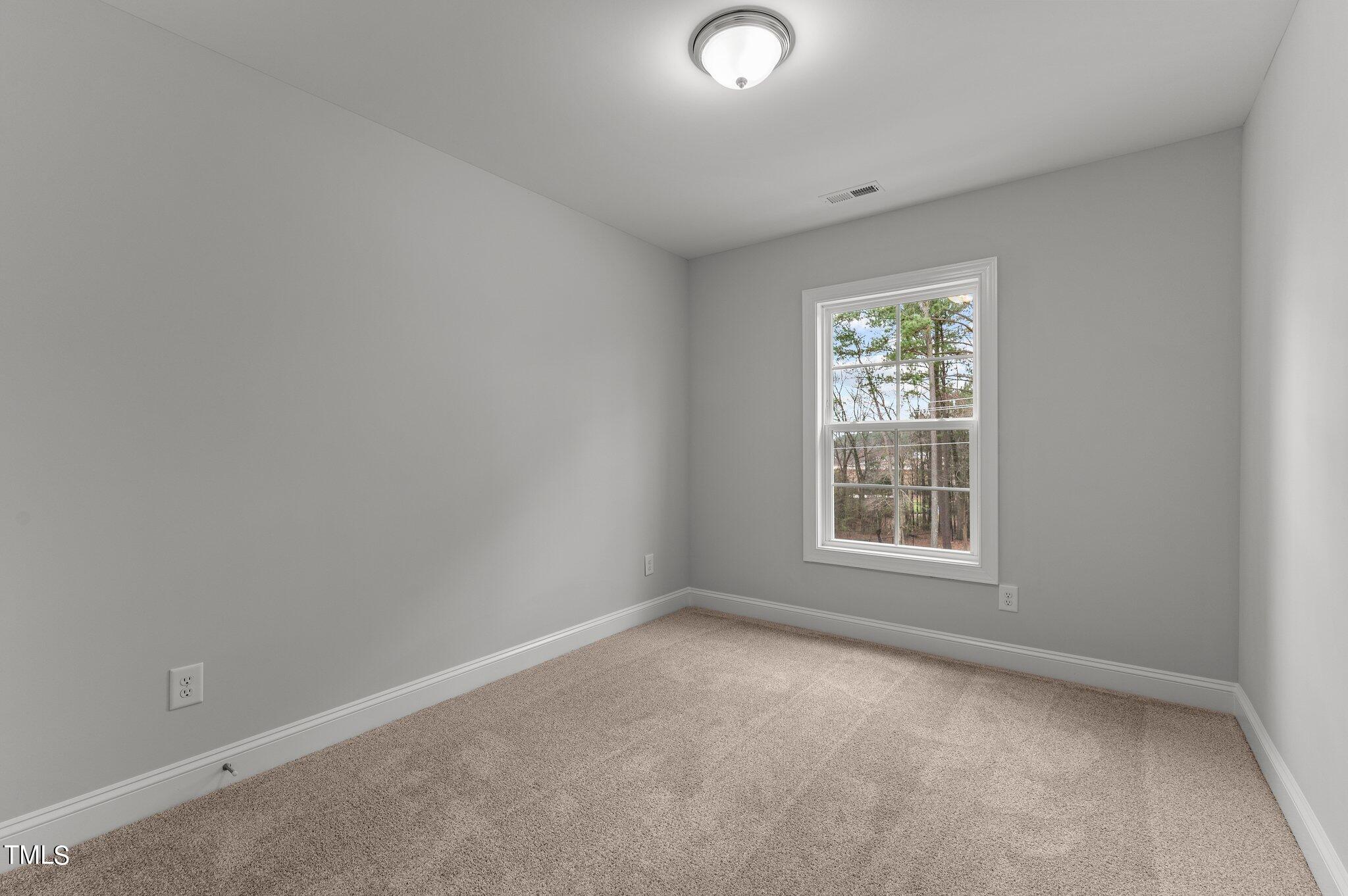 579 Forestville Road Wake Forest, NC 27587 - Photo 27 of 34 an empty room with a window