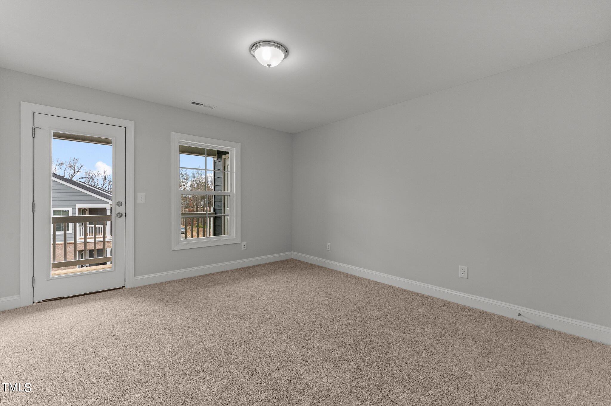 579 Forestville Road Wake Forest, NC 27587 - Photo 29 of 34 an empty room with windows