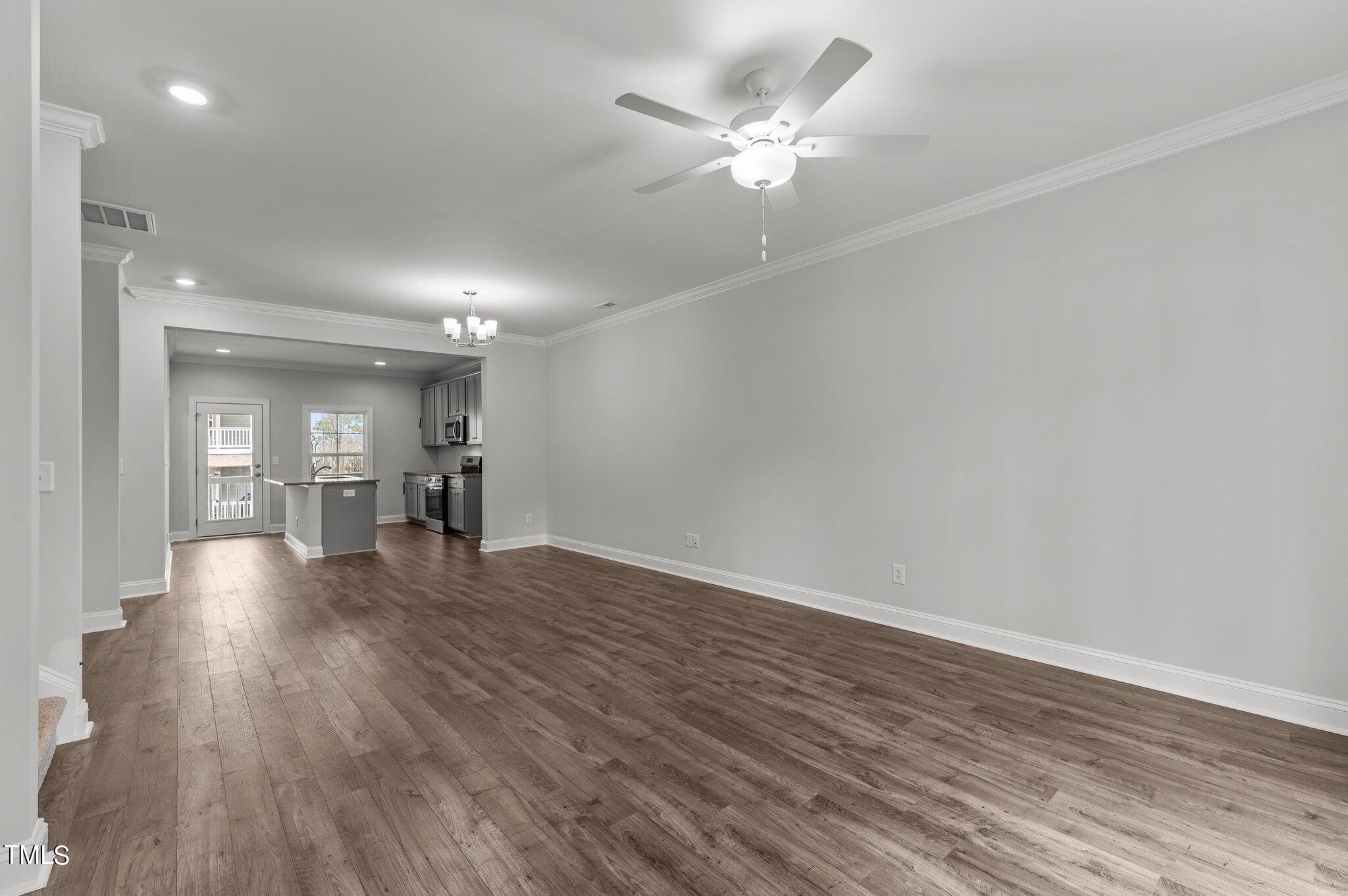 579 Forestville Road Wake Forest, NC 27587 - Photo 3 of 34 a view of empty room with wooden floor