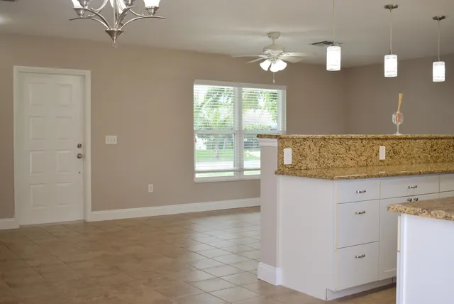 a bathroom with a sink vanity and granite