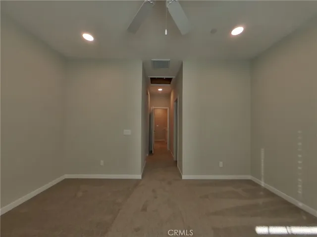 a view of an empty room with a bathroom