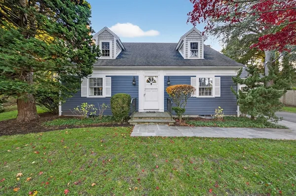 front view of a house with a yard