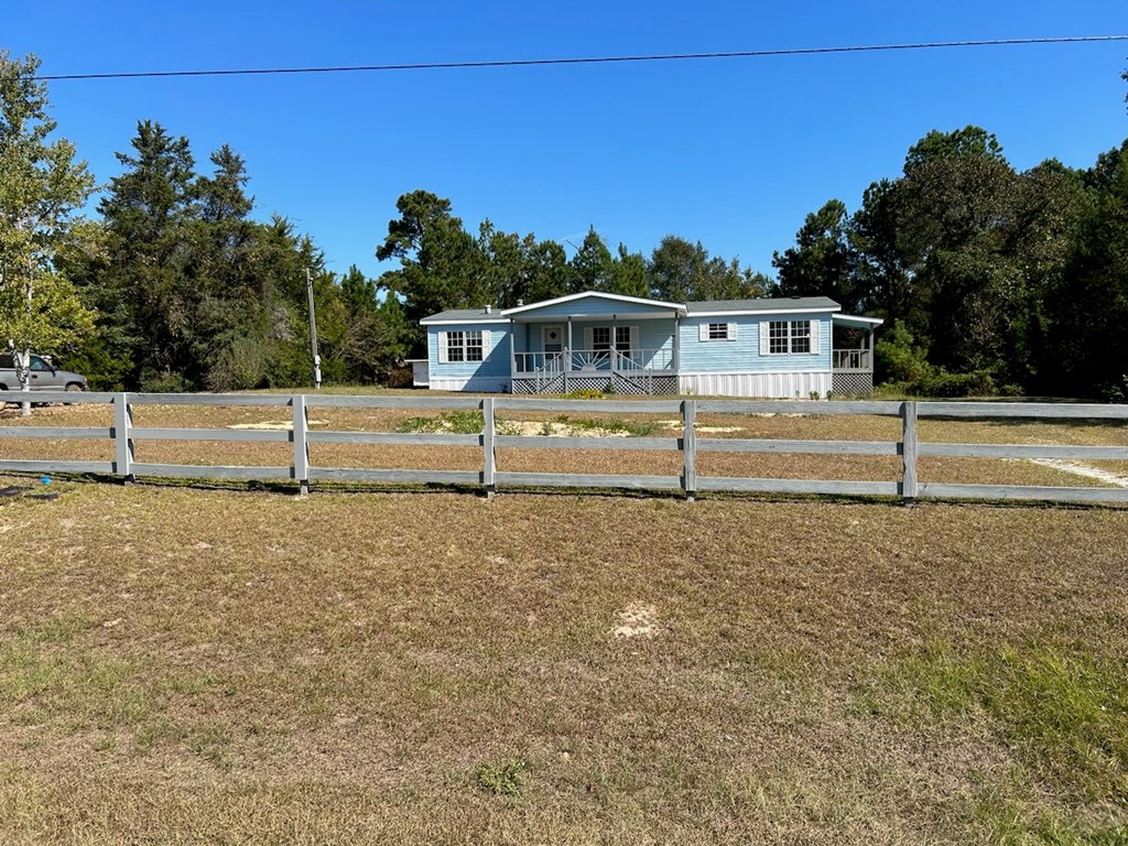 1300 Dr Brooks Road Box Springs, GA 31801 - Photo 2 of 16 a view of a house with a yard