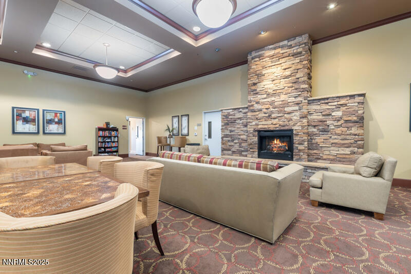 450 North Arlington Avenue, Unit 302 Reno, NV 89503 - Photo 13 of 21 a living room with furniture and a fireplace