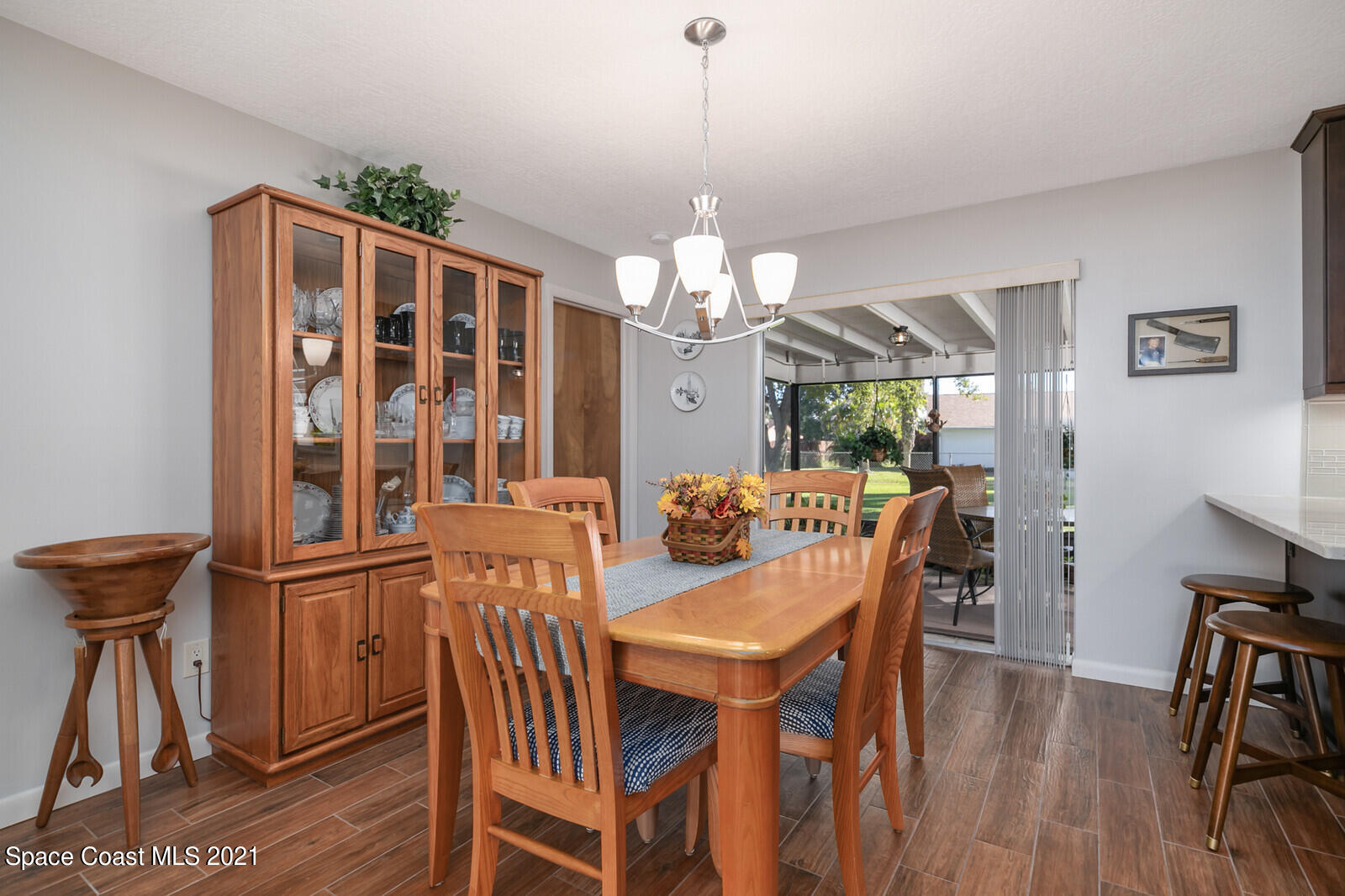 791 Montclair Road Northeast Palm Bay, FL 32905 - Photo 23 of 69 a view of a dining room with furniture window and wooden floor
