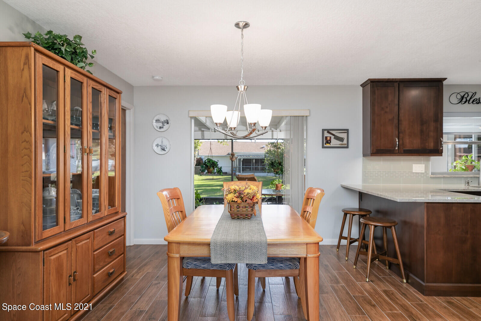 791 Montclair Road Northeast Palm Bay, FL 32905 - Photo 24 of 69 a view of a dining room with furniture window and wooden floor