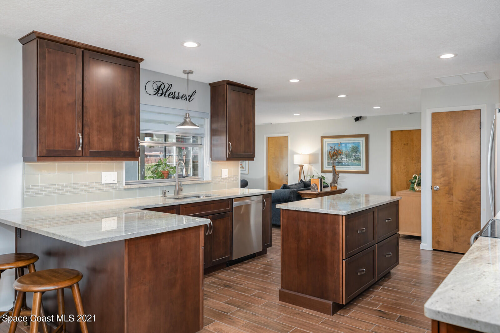 791 Montclair Road Northeast Palm Bay, FL 32905 - Photo 25 of 69 a kitchen with lots of counter space sink and appliances