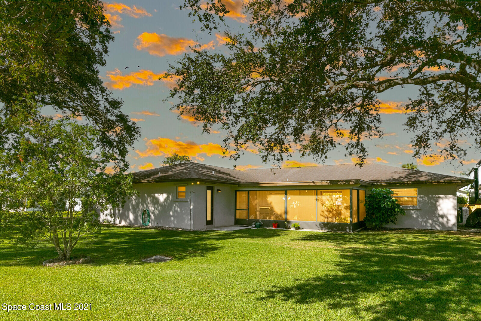 791 Montclair Road Northeast Palm Bay, FL 32905 - Photo 3 of 69 a front view of a house with a garden