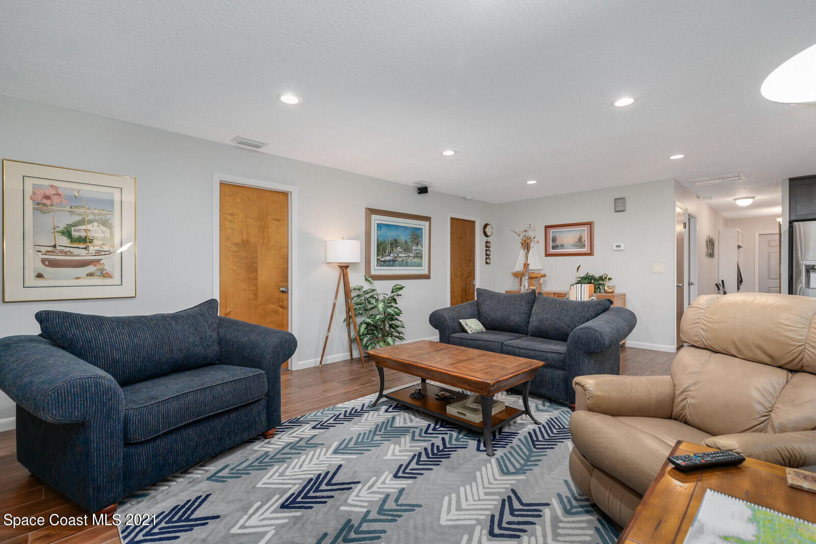 791 Montclair Road Northeast Palm Bay, FL 32905 - Photo 32 of 69 a living room with furniture and a couch