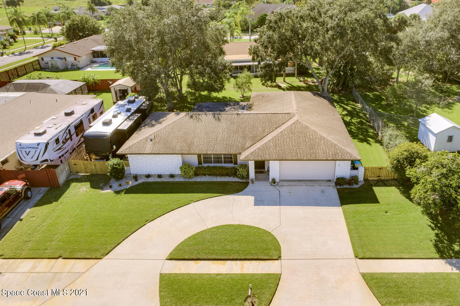 791 Montclair Road Northeast Palm Bay, FL 32905 - Photo 4 of 69 an aerial view of a house with a yard