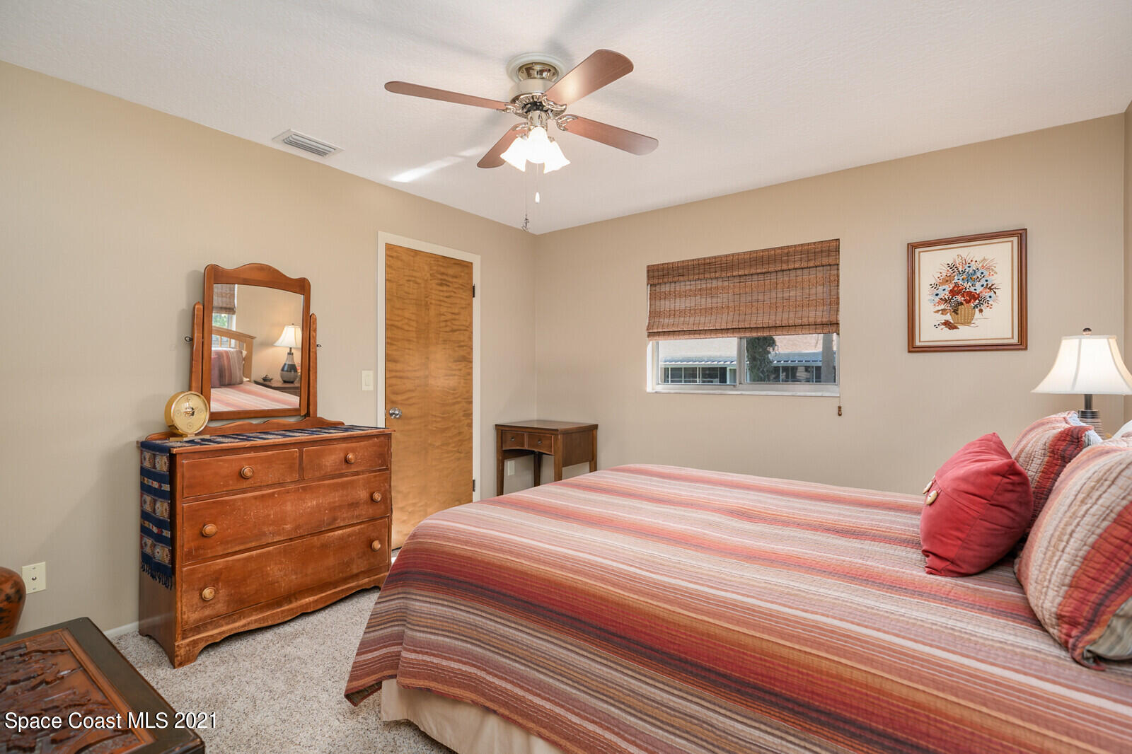 791 Montclair Road Northeast Palm Bay, FL 32905 - Photo 41 of 69 a bedroom with a bed and a dresser
