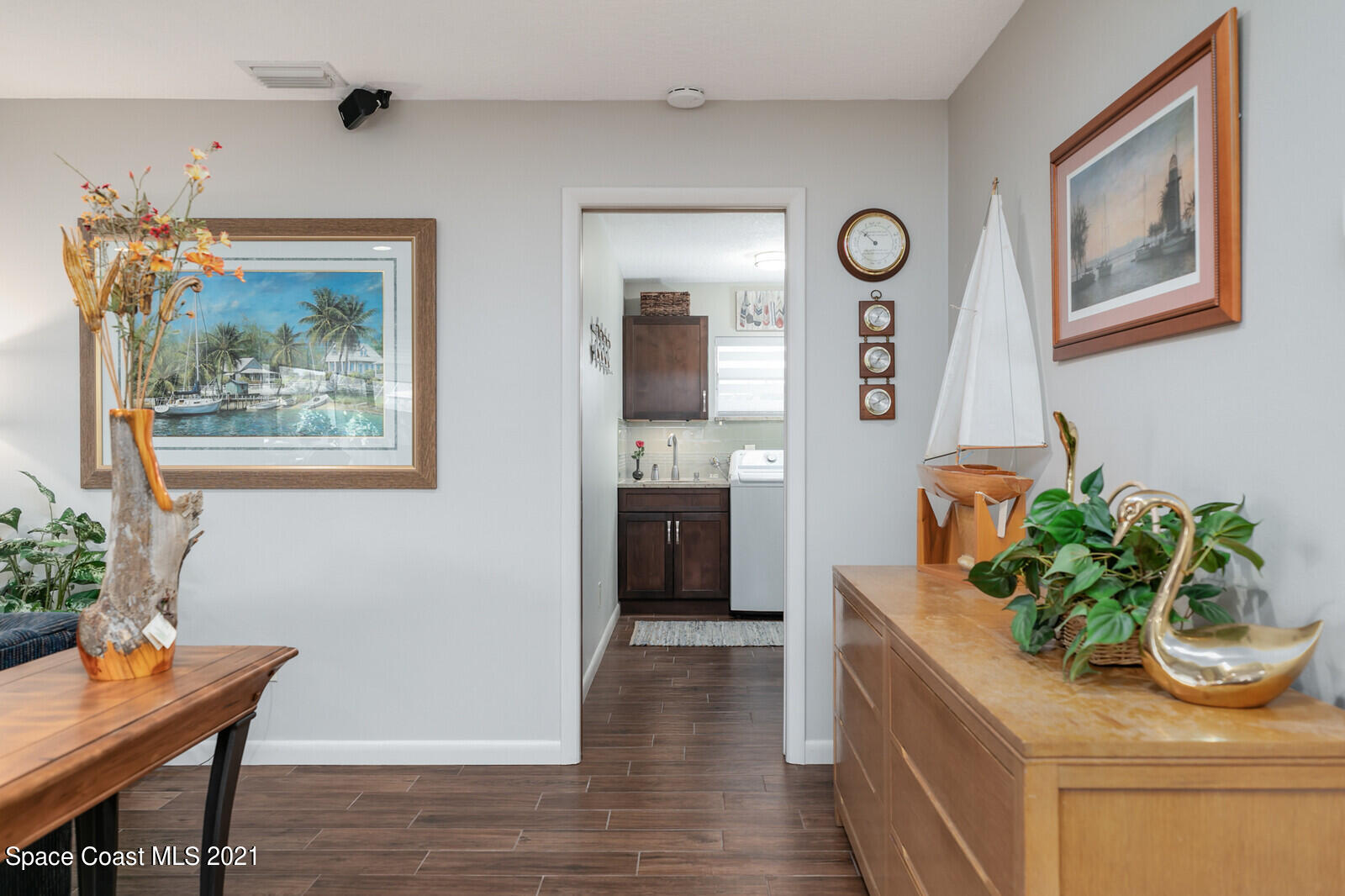 791 Montclair Road Northeast Palm Bay, FL 32905 - Photo 44 of 69 a living room with furniture and a potted plant