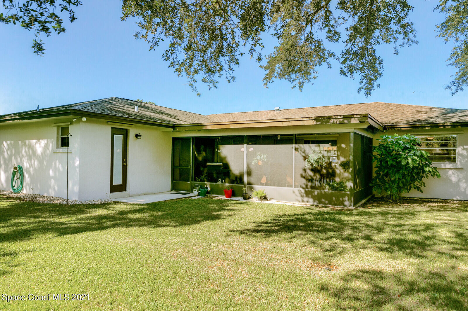 791 Montclair Road Northeast Palm Bay, FL 32905 - Photo 53 of 69 a view of a house with a big yard