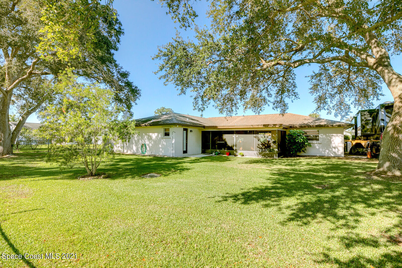 791 Montclair Road Northeast Palm Bay, FL 32905 - Photo 8 of 69 a front view of house with yard and green space