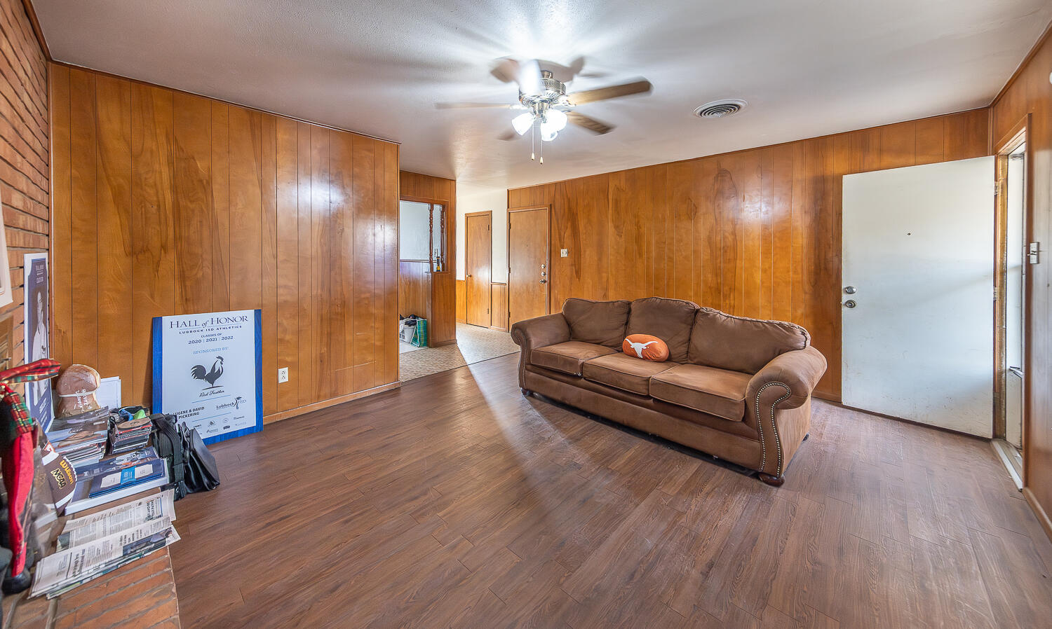 2410 33rd Street Lubbock, TX 79411 - Photo 11 of 14 a living room with furniture and a wooden floor
