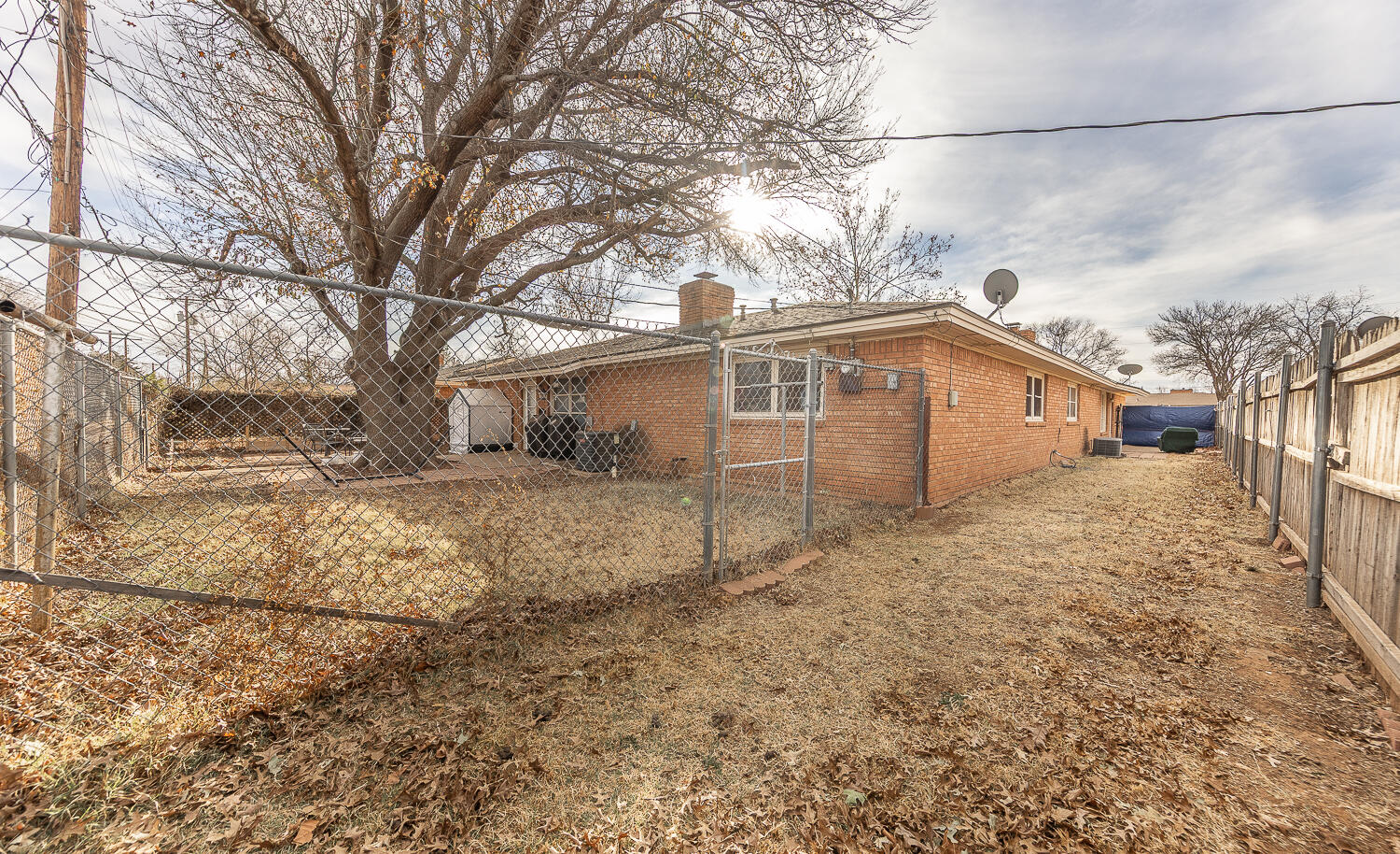 2410 33rd Street Lubbock, TX 79411 - Photo 13 of 14 a view of a house with a yard covered in snow