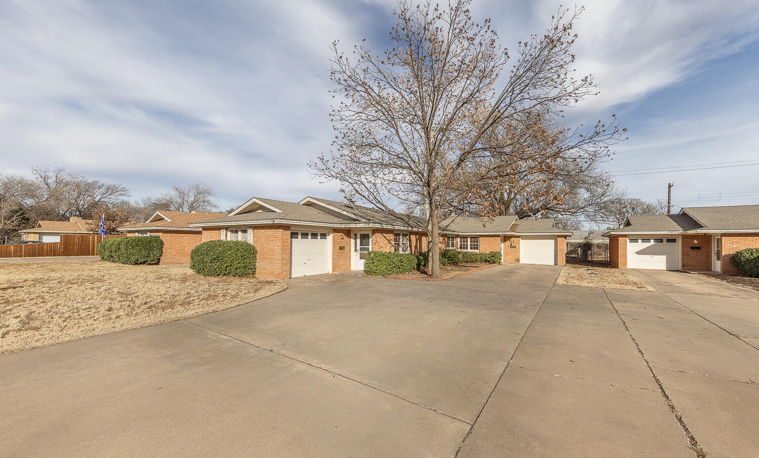 2410 33rd Street Lubbock, TX 79411 - Photo 14 of 14 a front view of house with yard and trees