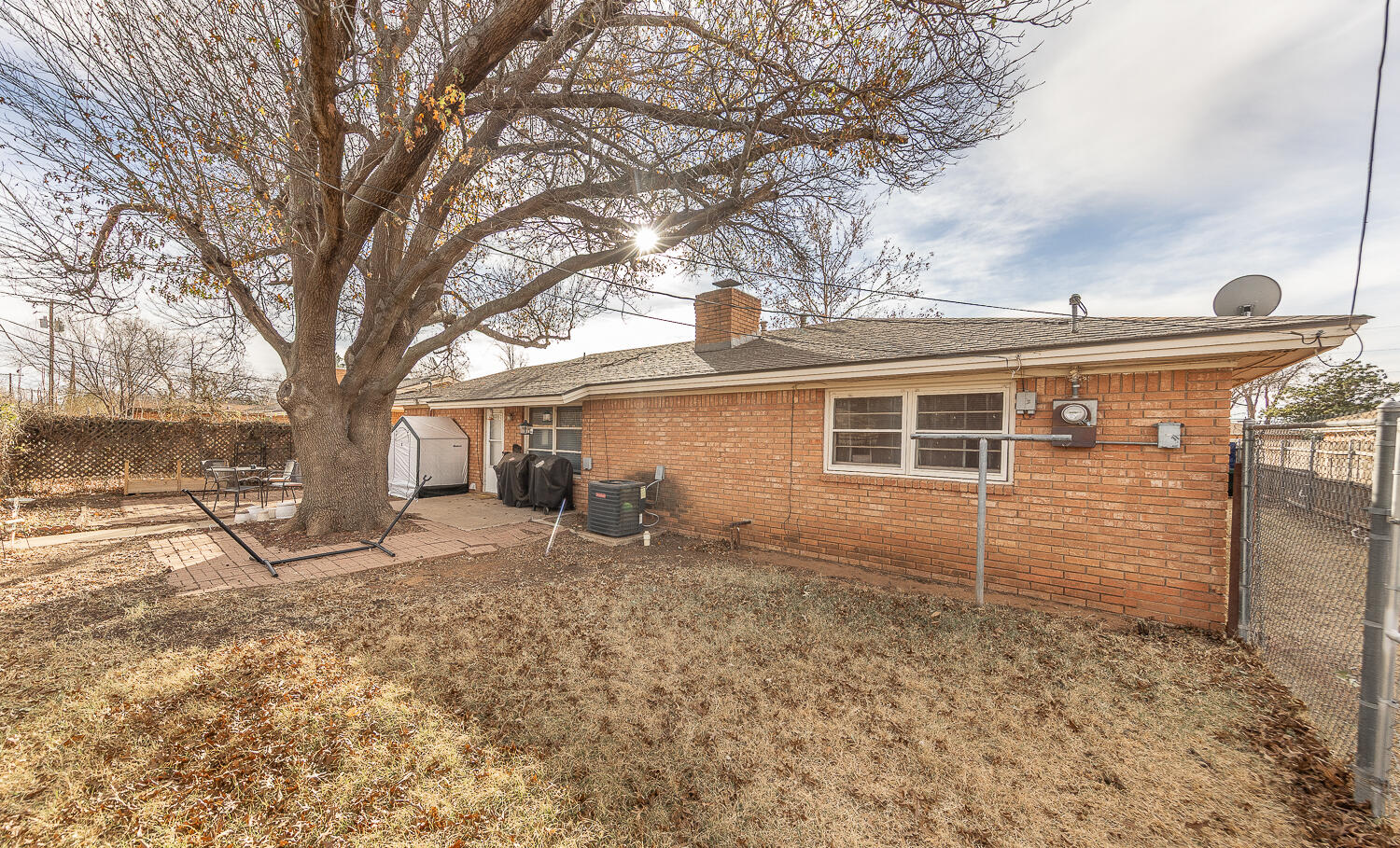 2410 33rd Street Lubbock, TX 79411 - Photo 3 of 14 a view of a house with a yard
